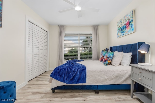 bedroom featuring ceiling fan, a closet, and light hardwood / wood-style floors