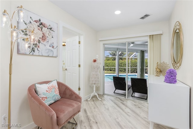 sitting room with light hardwood / wood-style floors