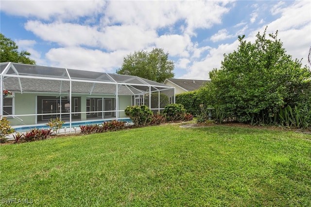 view of yard featuring a lanai