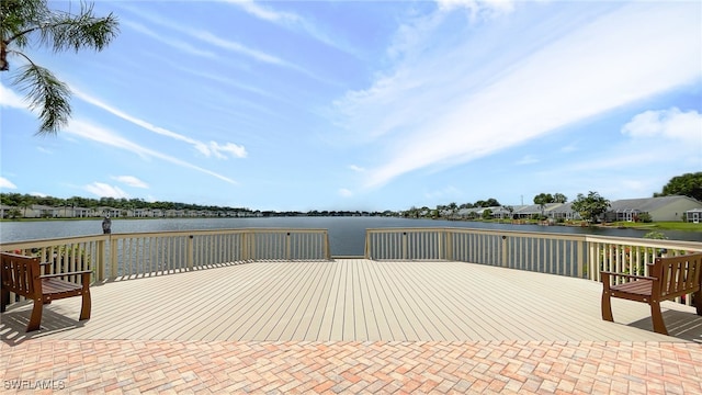 view of patio with a deck with water view