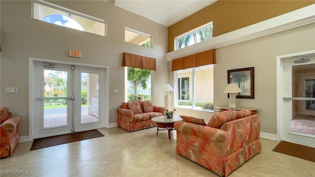 tiled living room with a towering ceiling and a wealth of natural light