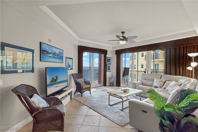 living room featuring ornamental molding, light tile patterned floors, and ceiling fan