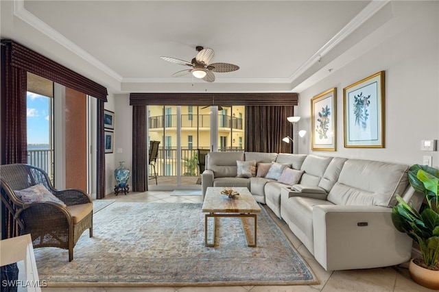 living room featuring ornamental molding, light tile patterned flooring, and ceiling fan