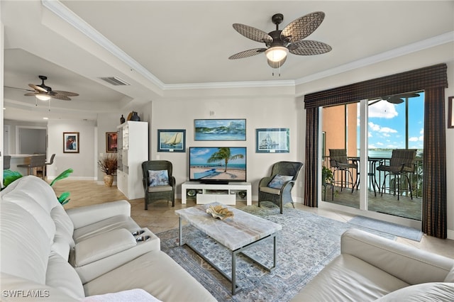 tiled living room with ornamental molding and ceiling fan