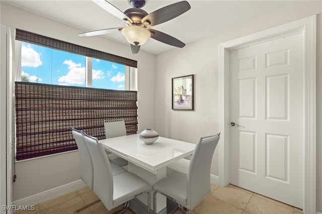 dining room featuring ceiling fan and light tile patterned floors