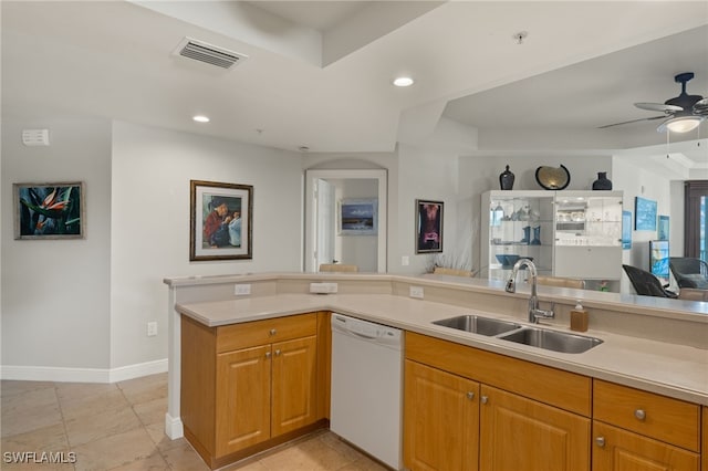 kitchen with kitchen peninsula, sink, white dishwasher, and ceiling fan