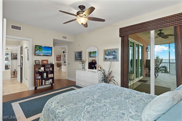 bedroom with ceiling fan, access to outside, and dark hardwood / wood-style flooring