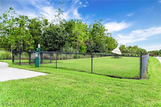 7638 Jacaranda Ln, Naples, FL 34114 - surrounding community with fence and a yard