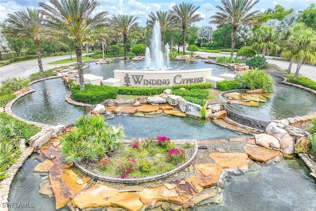 7638 Jacaranda Ln, Naples, FL 34114 - view of community featuring a garden pond