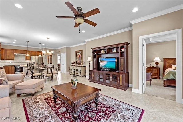 tiled living room with crown molding and ceiling fan with notable chandelier