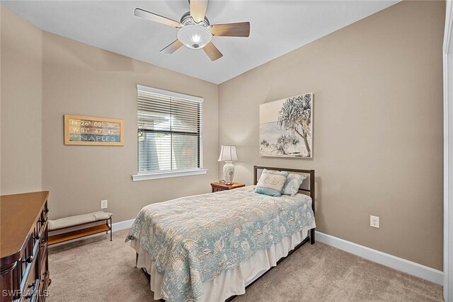 7638 Jacaranda Ln, Naples, FL 34114 - carpeted bedroom with baseboards and ceiling fan