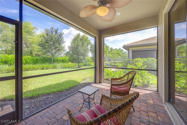 7638 Jacaranda Ln, Naples, FL 34114 - sunroom featuring a wealth of natural light and a ceiling fan