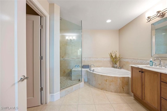 bathroom with tile patterned flooring, plus walk in shower, and vanity