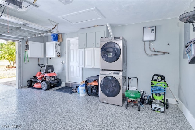 washroom with stacked washing maching and dryer