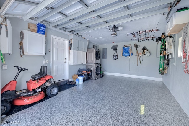 garage with electric panel and stacked washer / drying machine