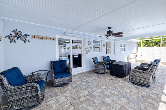 view of patio with ceiling fan and outdoor lounge area