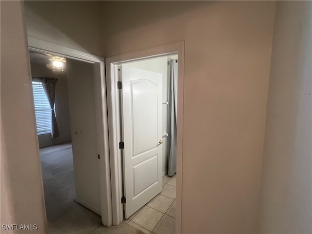 hallway with light tile patterned floors