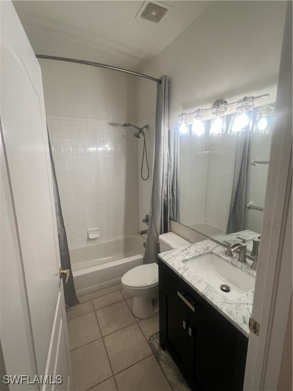 full bathroom with shower / bath combination with curtain, tile patterned floors, vanity, and toilet