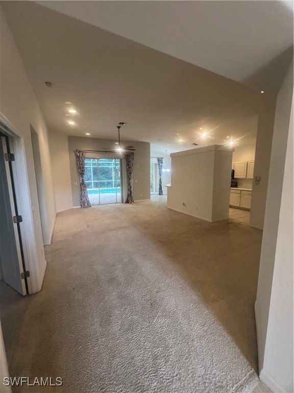 unfurnished living room with light carpet