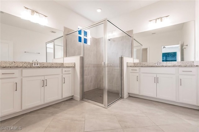 17364 Walnut Run Dr, Alva, FL 33920 - bathroom featuring two vanities, a sink, and a shower stall