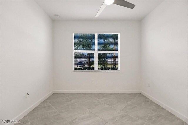 17364 Walnut Run Dr, Alva, FL 33920 - spare room featuring a ceiling fan and baseboards