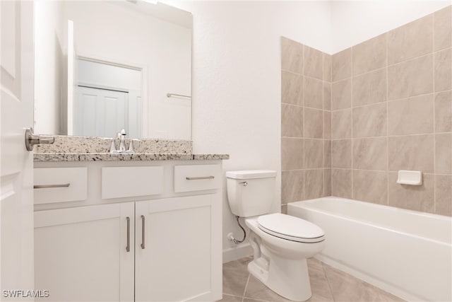 full bathroom featuring vanity, toilet, tile patterned floors, and tiled shower / bath