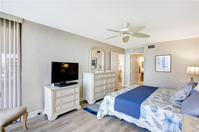 bedroom featuring light wood-type flooring and ceiling fan