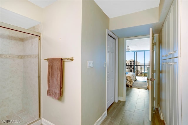 bathroom featuring walk in shower and wood-type flooring