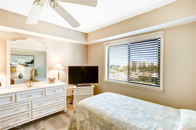 bedroom with ceiling fan and light wood-type flooring