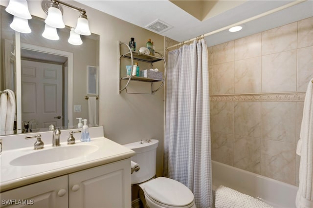 full bathroom featuring shower / tub combo with curtain, vanity, and toilet