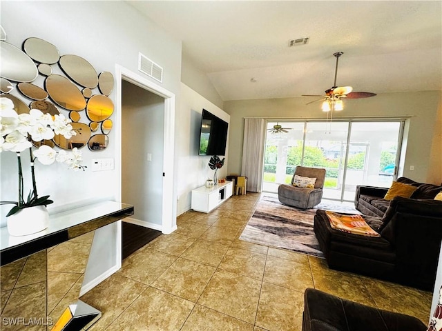 living room featuring tile patterned floors, vaulted ceiling, and ceiling fan