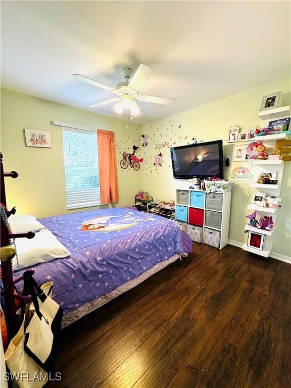 bedroom with ceiling fan and dark wood-type flooring