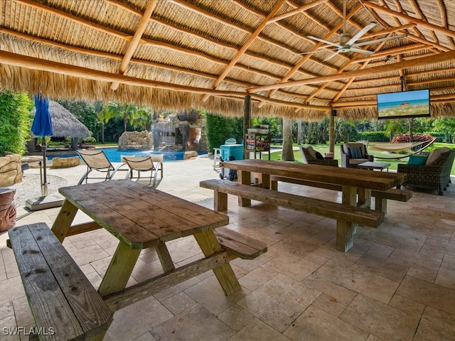 view of patio / terrace featuring a gazebo and ceiling fan