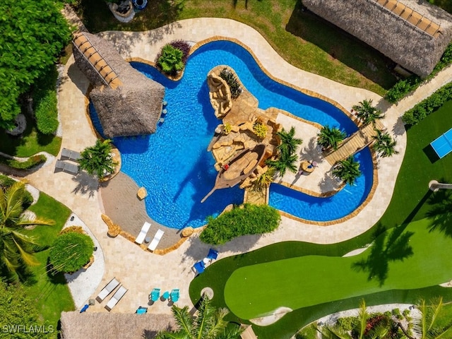 view of pool with a patio and a hot tub