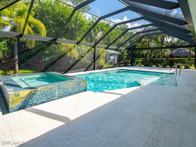 view of pool with an in ground hot tub, a lanai, and a patio area