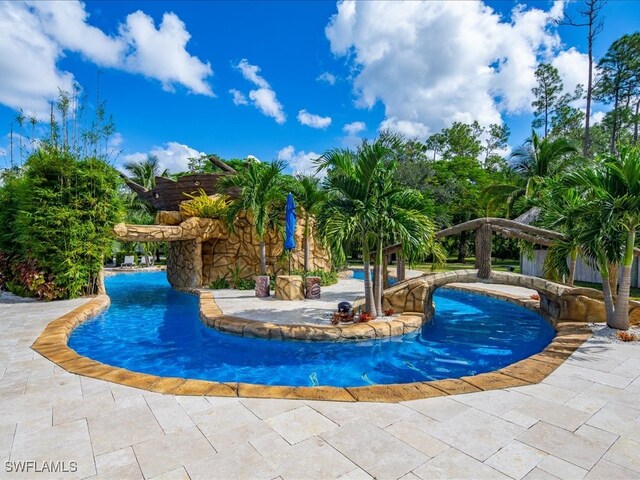 view of swimming pool with a patio area