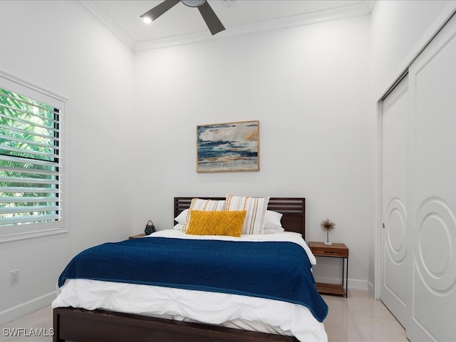 bedroom featuring ceiling fan, a closet, and ornamental molding