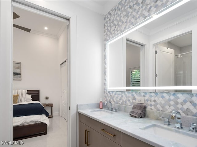 bathroom with walk in shower, crown molding, vanity, and decorative backsplash