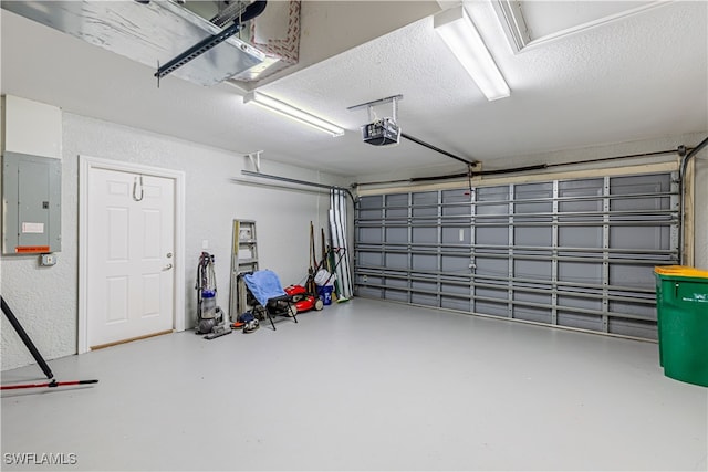 garage featuring a garage door opener and electric panel