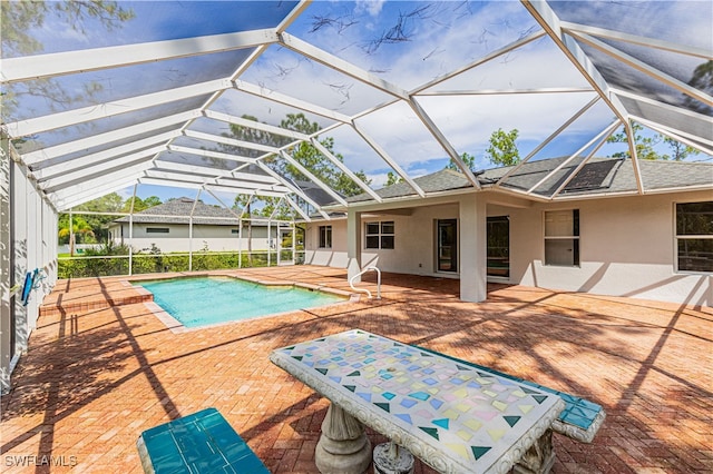 view of pool featuring a lanai and a patio area