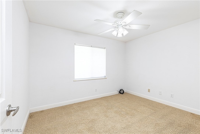 spare room with carpet flooring and ceiling fan