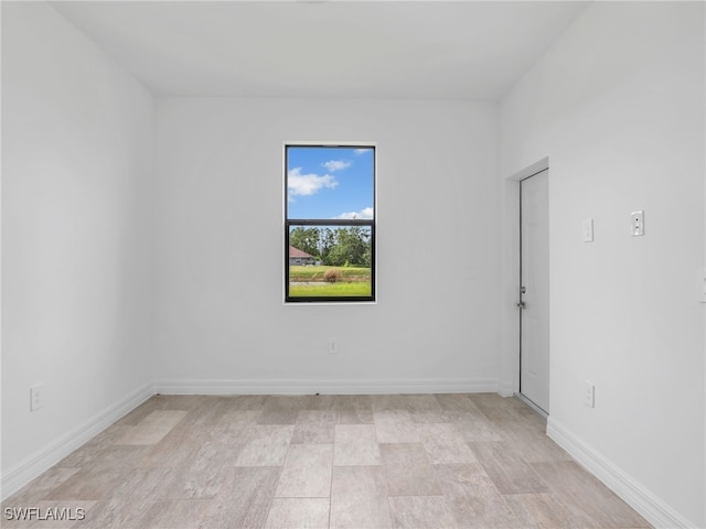 spare room with light hardwood / wood-style floors