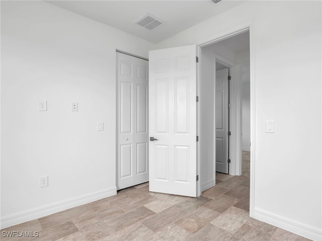 unfurnished bedroom with a closet