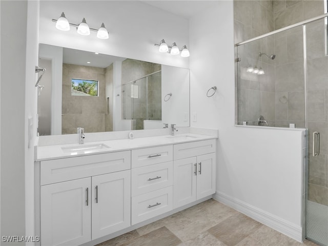 bathroom with walk in shower and vanity