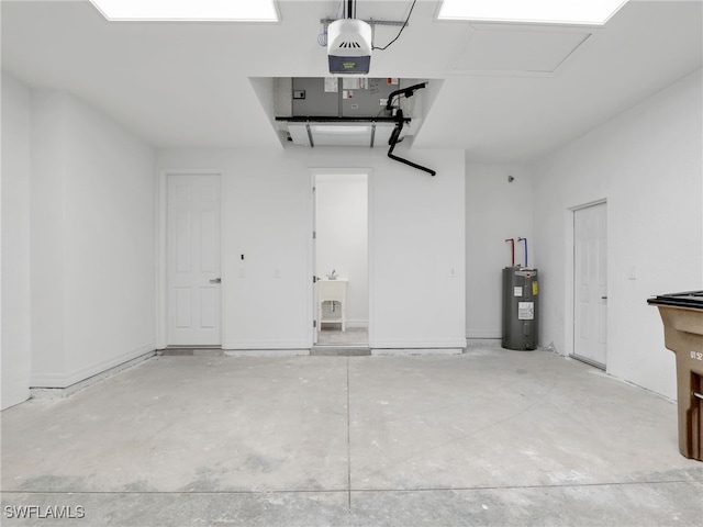 garage featuring electric water heater and a garage door opener