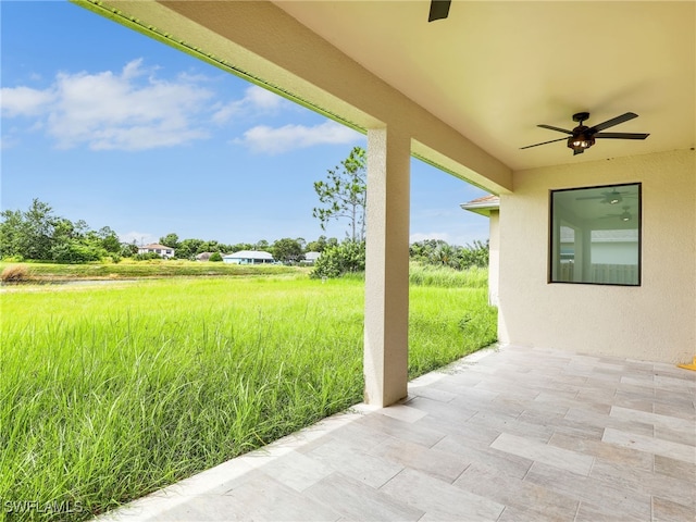 view of patio / terrace featuring ceiling fan