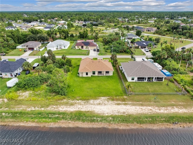 drone / aerial view with a water view