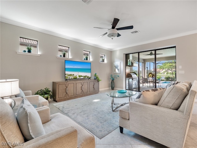 living room featuring ceiling fan, ornamental molding, and light tile patterned floors