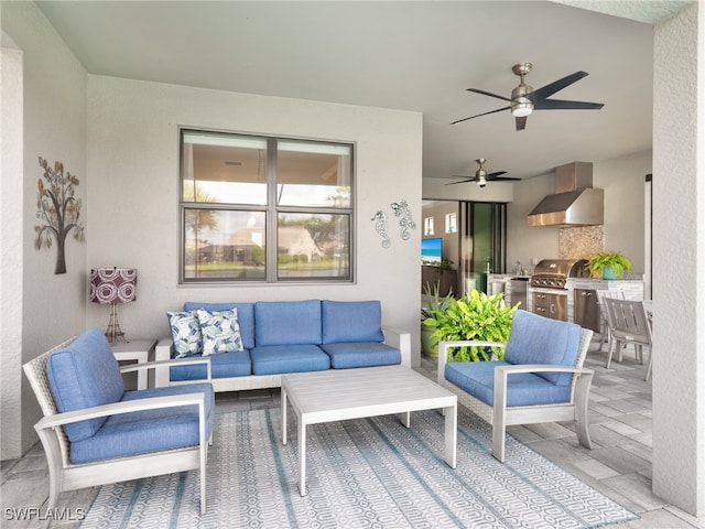 view of patio featuring ceiling fan, grilling area, an outdoor hangout area, and an outdoor kitchen