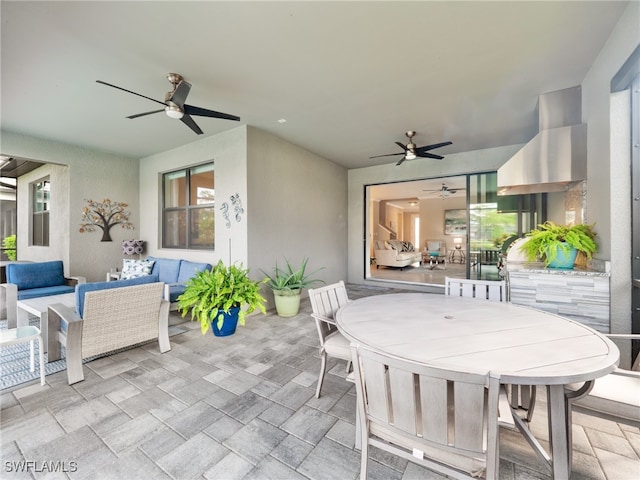 view of patio with outdoor lounge area and ceiling fan